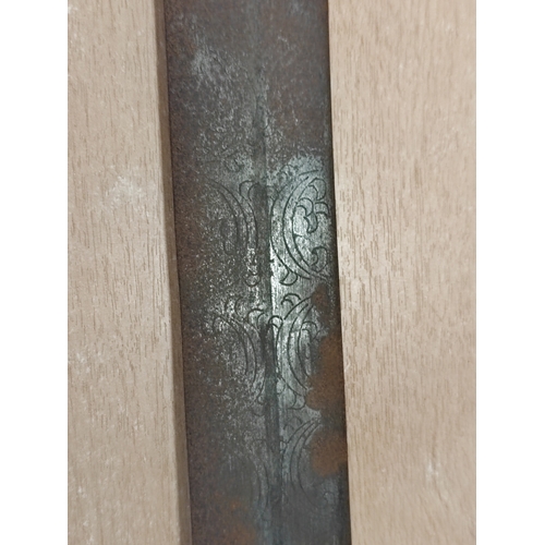 71 - Dominican Republic Kaskara sword with leather scabbard, 80% ornately etched blade with patterns and ... 