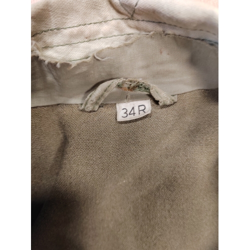 82 - Range of WW2 uniforms with U.S. winter jumper, wool trousers and belt, officer shirt and jacket, mix... 