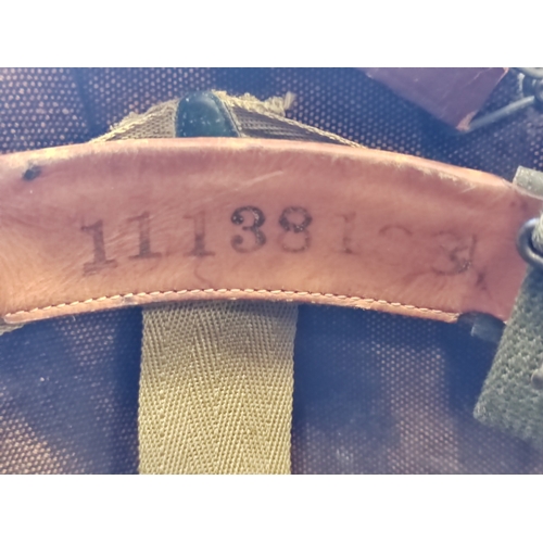 96 - U.S. M1 Helmet with swivel bale, netting and liner, inner material straps marked W-199-QM 39934 VOGT... 