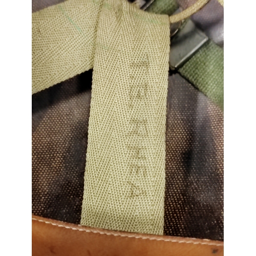 96 - U.S. M1 Helmet with swivel bale, netting and liner, inner material straps marked W-199-QM 39934 VOGT... 
