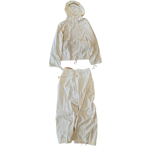 97 - U.S. Army snow suit dated 1944, some minor marks and stain to jacket and trousers otherwise extremel... 