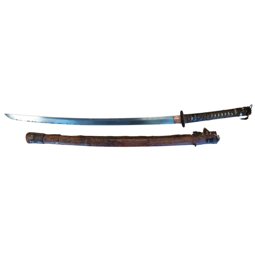Japanese Katana with leather scabbard, light discolouration to blade and slight pitting towards tip, brass habaki and seppa, iron tsuba and fuchi, worn wrap to grip, unable to remove peg (Mekugi) so unable to view tang, peeling to scabbard overall very fine. BUYER MUST COLLECT.