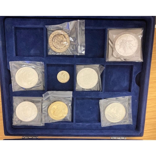 92 - COINS : Silver coins in blue display case, three Silver Britannia's, one Canada Maple plus a 1946 GV... 