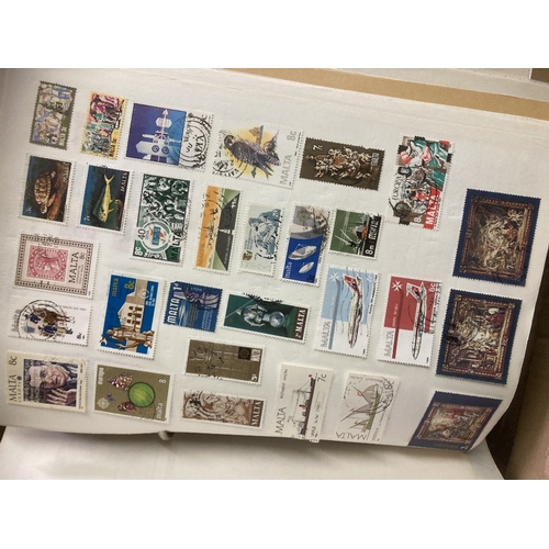 27 - Large collection of stamps including year books etc (heavy lot in 2 boxes), buyer to collect