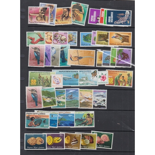 565 - STAMPS PAPUA Mint and used stock in binder, ex dealers, some useful sets and singles