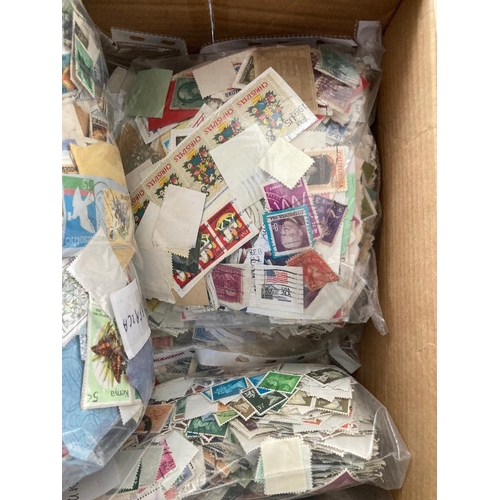 129 - STAMPS : Box crammed with used stamps sorted in bags (1000's)