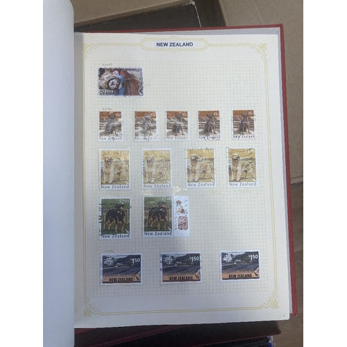 147 - CHARITY STAMPS : Eleven albums, with World stamps mainly boxed spring-back albums, being sold on beh... 