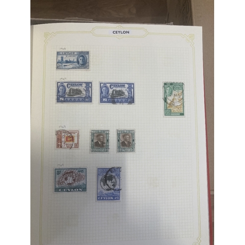 147 - CHARITY STAMPS : Eleven albums, with World stamps mainly boxed spring-back albums, being sold on beh... 