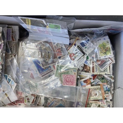 59 - STAMPS CHARITY : Box of mixed off paper World stamps (1000's) (being sold on behalf of the Friends o... 