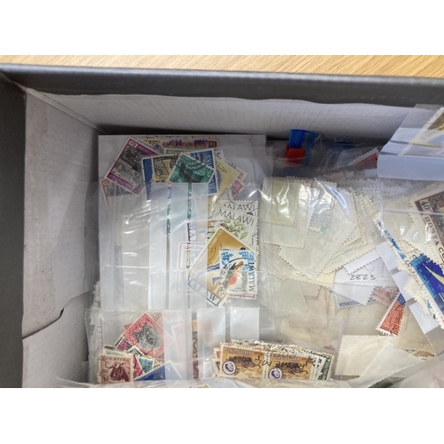 59 - STAMPS CHARITY : Box of mixed off paper World stamps (1000's) (being sold on behalf of the Friends o... 