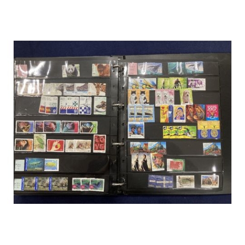 391 - STAMPS AUSTRALIA Mint and used ex dealers stock, well filled display book with better spotted Roo's ... 