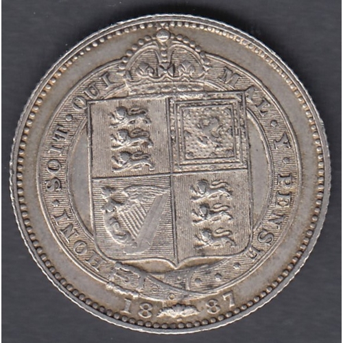 528 - COINS 1887 QV Shilling in VF to EF condition