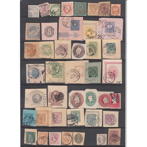 80 - STAMPS CHARITY Two stock pages with Postal stationery cut outs from around the World. Being sold on ... 