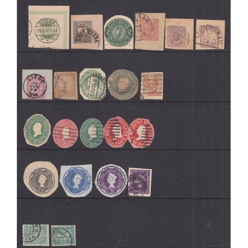 80 - STAMPS CHARITY Two stock pages with Postal stationery cut outs from around the World. Being sold on ... 