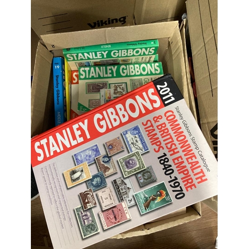 117 - Box of stamp catalogues including Stanley Gibbons, Scott World set etc