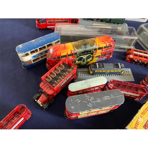 74 - Box of various model trains and trams some on display bases