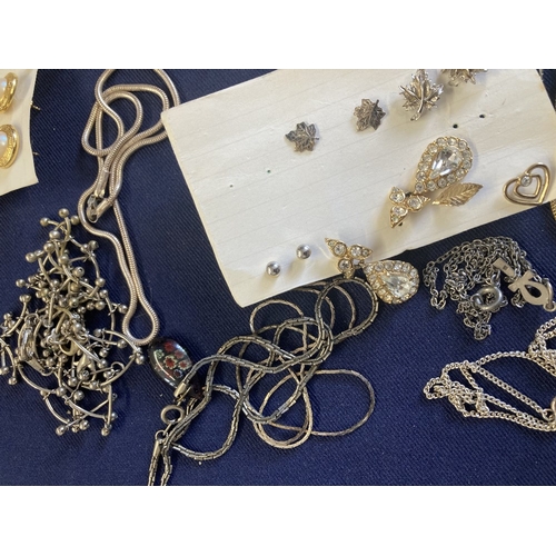 59 - Large amount of costume jewellery, maybe some unmarked silver chains