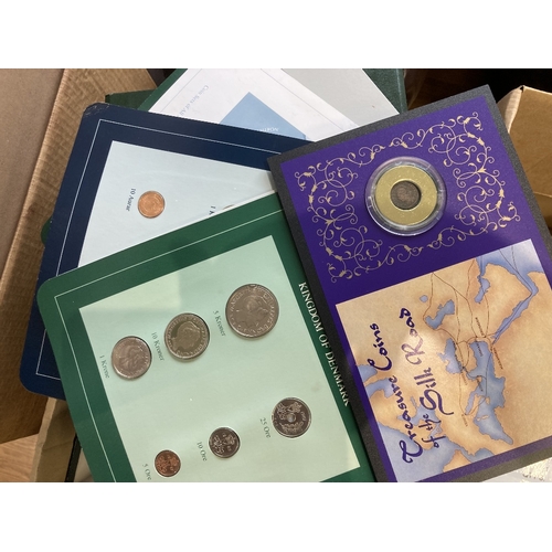 562 - Box of coin covers, mostly GB or Channel Islands etc, 60+ covers, plus a few coin packs etc. Also a ... 