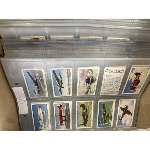 119 - CIGARETTE CARDS Box with 79 complete sets, neatly displayed in plastic cigarette card pages. All app... 