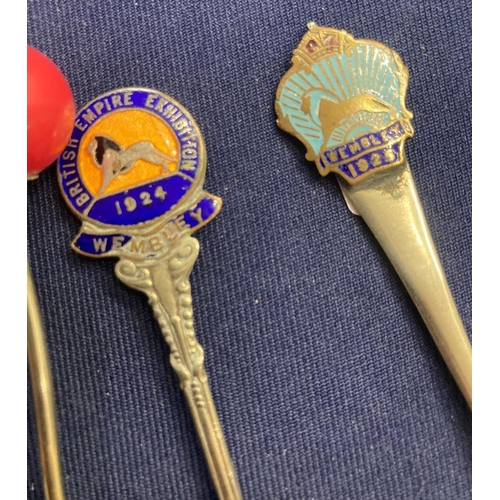 57 - Four silver plated 1924 Wembley Exhibition spoons