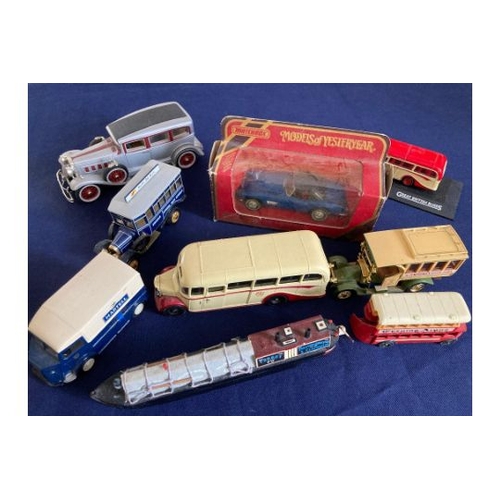 24 - Small accumulation of model buses and commercial vehicles plus narrow boat