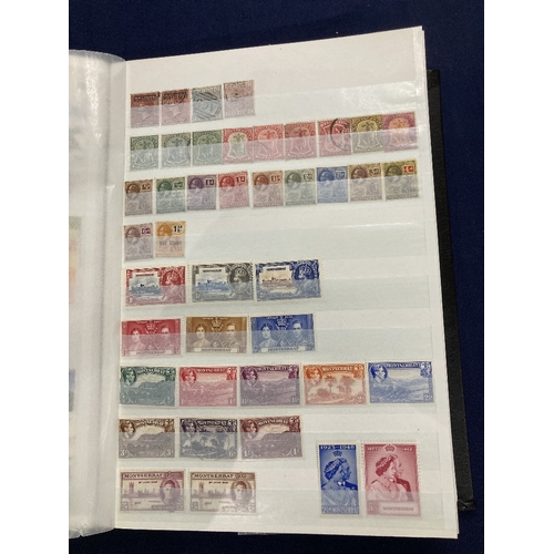 69 - STAMPS British Commonwealth QV to QEII mint and used in stock book M-N, including 1948 Wedding mint ... 