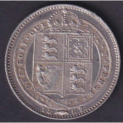 125 - 1887 QV Silver Shilling in very fine condition