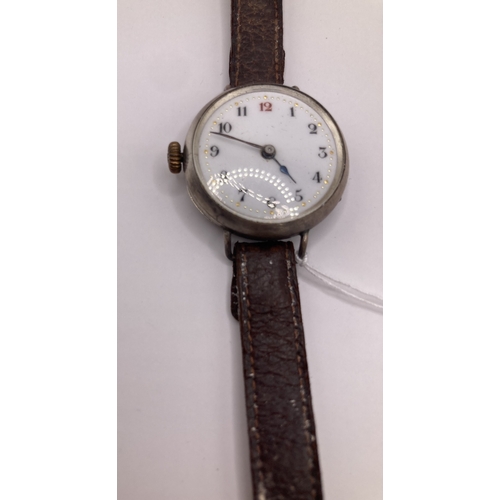 212 - Vintage Silver cased wristwatch with winder by the 9 ! for wearing on right hand, doesn't appear to ... 