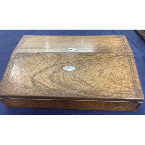 4 - Wooden writing slope probably Walnut with inlaid mother of pearl to lid, minor damage but it does in... 