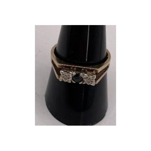 221 - Jewellery : 9ct Gold ring Size Q with two small illusion set diamonds (tested) and central dark ston... 