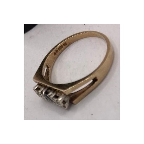 221 - Jewellery : 9ct Gold ring Size Q with two small illusion set diamonds (tested) and central dark ston... 