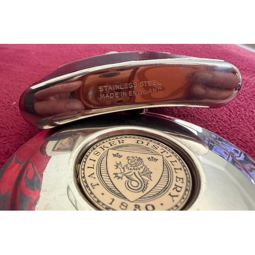 176 - Two stainless steel hip flasks, one with leather effect outer, the other from Talisker Distillery