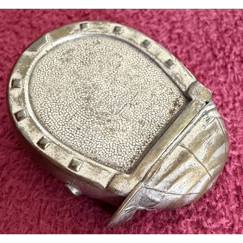 174 - Base metal vesta in the shape of a Horse Shoe with Jockey Cap lid, unusual