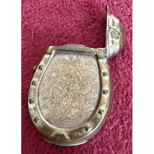 174 - Base metal vesta in the shape of a Horse Shoe with Jockey Cap lid, unusual
