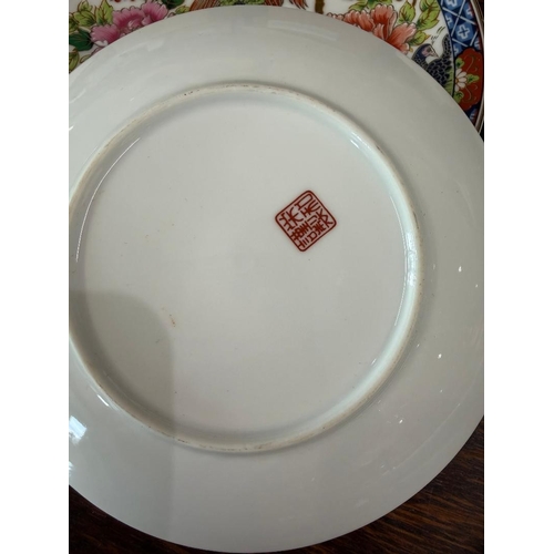 188 - Set of four decorative Chinese plates of exotic birds etc, uncertain of age, Chinese symbol to rear
