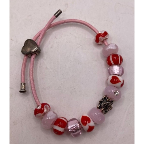 41 - Jewellery: Pandora style bracelet with coloured beads and a silver turtle charm. Heart clasp marked ... 