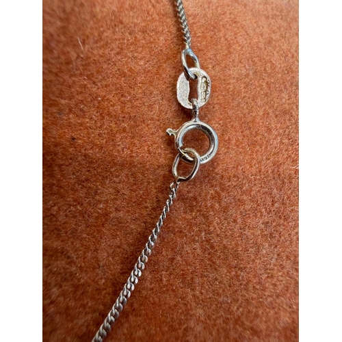 24 - Jewellery : 18ct White Gold pendant and chain. Pendant with four small diamonds total weight 3g     ... 