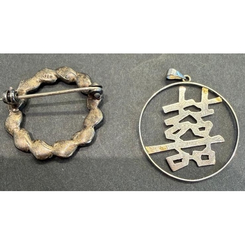 52 - Jewellery : Circular silver pendant with Japanese writing style design, plus silver broach total wei... 