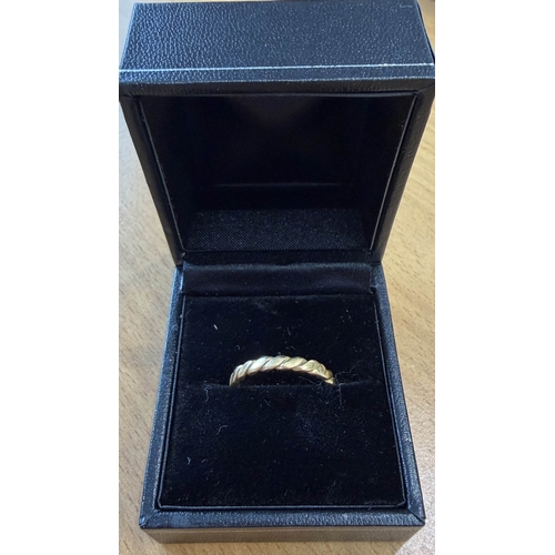 8 - Twist design Gold ring not hall marked but tested as 22ct, appears to have been resized at some poin... 