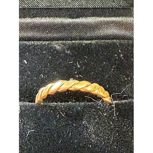 8 - Twist design Gold ring not hall marked but tested as 22ct, appears to have been resized at some poin... 