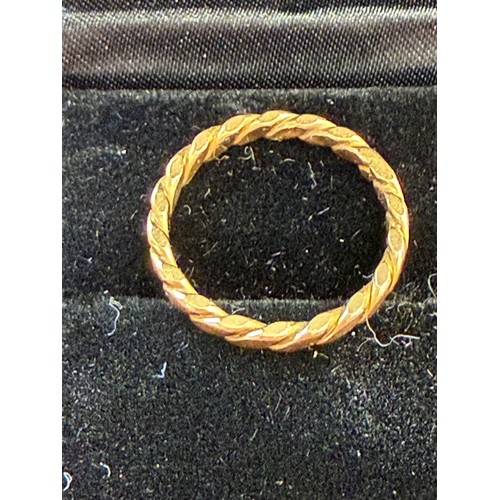 8 - Twist design Gold ring not hall marked but tested as 22ct, appears to have been resized at some poin... 