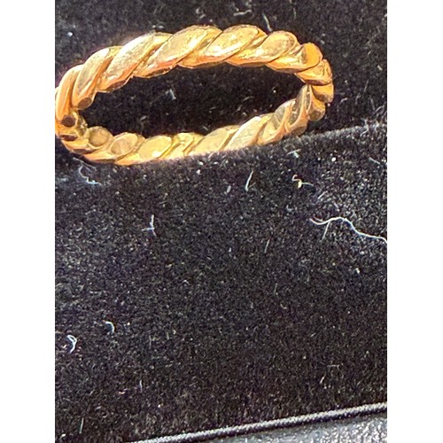 8 - Twist design Gold ring not hall marked but tested as 22ct, appears to have been resized at some poin... 