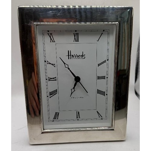 42 - Silver framed electric clock from Harrods, with clear Harrords mark and hallmarks