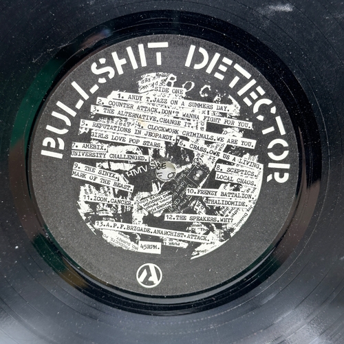 31 - A 12 inch vinyl album by Crass - BullShit Detector, cover / pull out is in good condition but it has... 