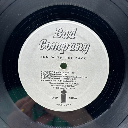 35 - A 12 inch vinyl album by Bad Company - Run With the Pack, cover has some age scuffs on the edges, no... 