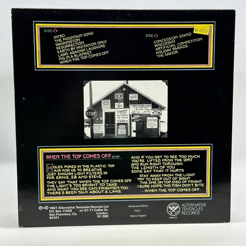 48 - A 12 inch vinyl album by The Crucifucks - Wisconsin, cover in good order, vinyl is bright yellow and... 