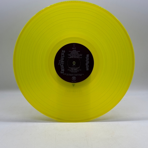 48 - A 12 inch vinyl album by The Crucifucks - Wisconsin, cover in good order, vinyl is bright yellow and... 