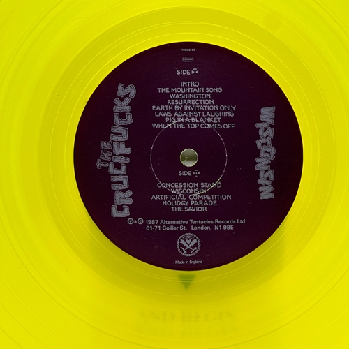 48 - A 12 inch vinyl album by The Crucifucks - Wisconsin, cover in good order, vinyl is bright yellow and... 