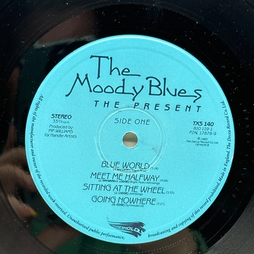 56 - A 12 inch vinyl album by Moody Blues - The Present