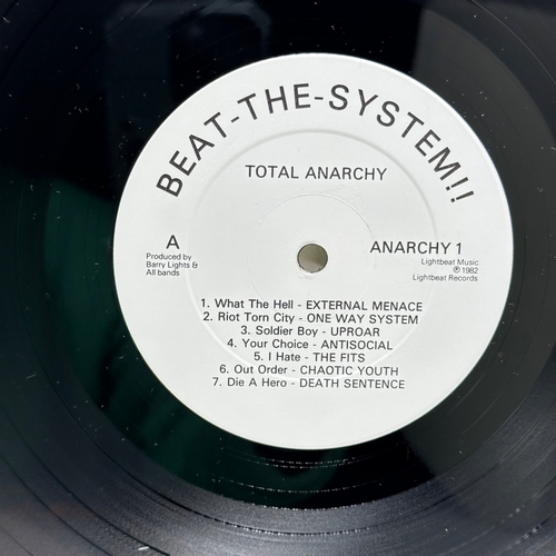 69 - A 12 inch vinyl album by Total Anarchy - Beat the System, glue has come off the top of the cover